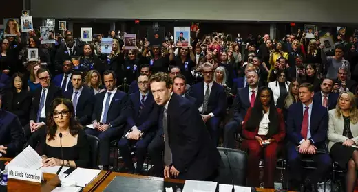 Meta's CEO Mark Zuckerberg returns to his seat after standing and facing the audience while he testified during the Senate Judiciary Committee hearing on online child sexual exploitation at the U.S. Capitol in Washington, D.C. on January 31, 2024