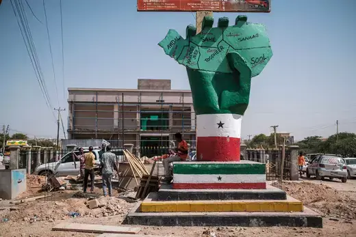 A statue of a hand painted in the colors of Somaliland's flag holds a map of the territory.