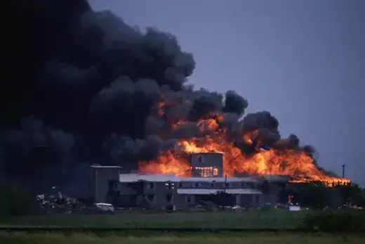 Smoke billows from the Branch Davidians’ compound as it burns to the ground outside of Waco, Texas, during a raid by federal agents.