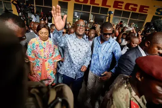 The Democratic Republic of Congo's President Felix Tshisekedi cheers at supporters after casting his vote at a polling station during the presidential election, in Kinshasa, the Democratic Republic of Congo on December 20, 2023.