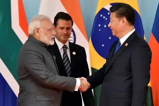 Chinese President Xi Jinping (R) and Indian Prime Minister Narendra Modi (L) shake hand beforethe group photo session of Dialogue of Emerging Market and Developing Countries, in sideline of 2017 BRICS Summit in Xiamen, Fujian province in China.