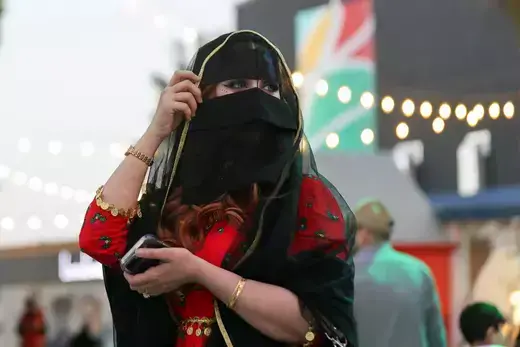 A Saudi woman wearing traditional clothes celebrates Saudi Arabia's Founding Day at The Boulevard in Riyadh, Saudi Arabia, February 23, 2023. 
