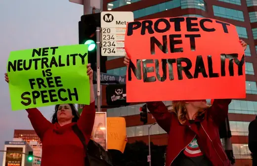 Supporters protest the FCC's recent decision to repeal the program in Los Angeles, California on November 28, 2017.
