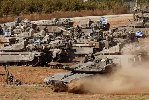 An Israeli tank maneuvers, amid the ongoing conflict between Israel and the Palestinian Islamist group Hamas, near the Israel-Gaza Border, in southern Israel.