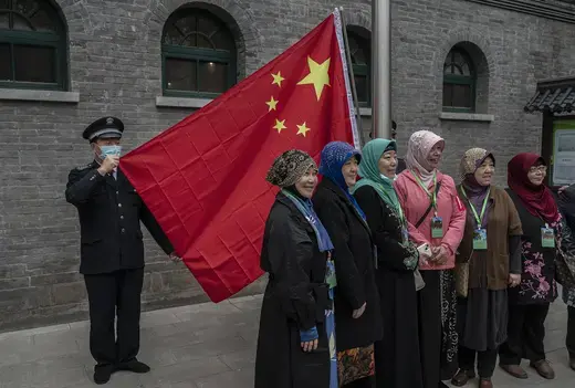 Chinese Hui Muslim women gather for a group photo before a flag raising ceremony before Eid al-Fitr prayers at the historic Niujie Mosque on April 22, 2023 in Beijing, China.