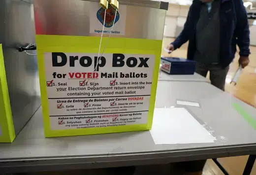 An election ballot box as viewed on a folding table. 