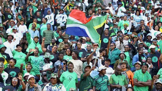 Supporters of former South African president Jacob Zuma's new political party wave the South African flag ahead of the launch of the party's election manifesto ahead of a general election.