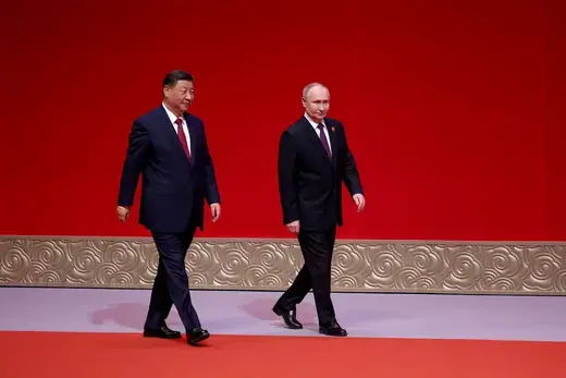Xi and Putin as viewed walking on a red carpet. 