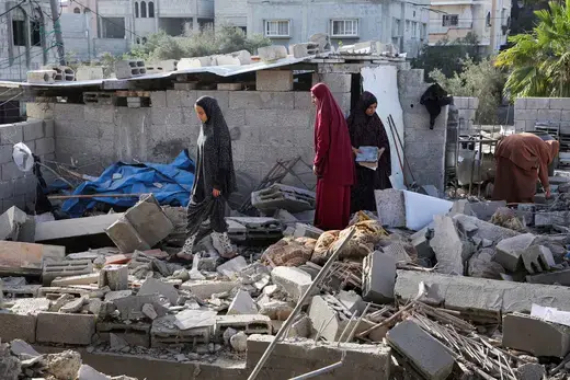 Women inspect as a house damaged in an Israeli strike lies in ruin, amid the ongoing conflict between Israel and the Palestinian Islamist group Hamas, in Rafah, in the southern Gaza Strip, May 3, 2024.