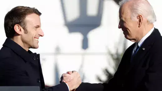 French President Emmanuel Macron greets U.S. President Joe Biden during an official State Arrival Ceremony on the South Lawn at the White House in Washington, U.S., December 1, 2022. REUTERS/Jonathan Ernst