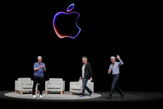 Apple CEO Tim Cook attends a panel discussion with Craig Federighi and John Giannandrea during the annual developer conference event at the company's headquarters in Cupertino, California, U.S. on June 10, 2024