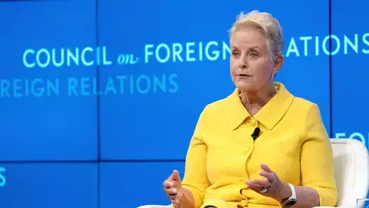 Cindy McCain sits presenting on CFR stage.