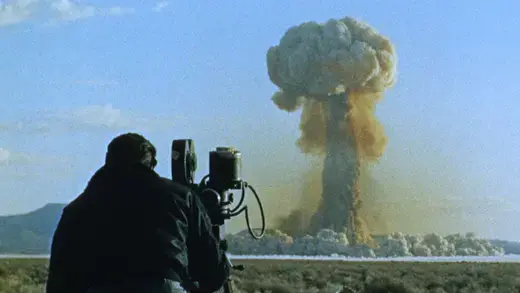 A cinematographer films an atomic mushroom cloud in a project named "Operation Plumbbob" Colorado.