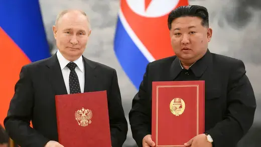 Russia’s President Vladimir Putin and North Korea’s leader Kim Jong Un pose for a photo during a signing ceremony in Pyongyang, North Korea.