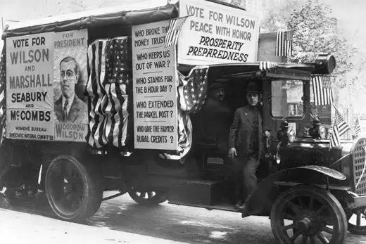 A campaign van decorated with posters supporting Democratic President Woodrow Wilson in 1916.
