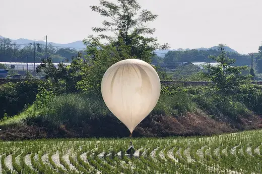 A trash balloon believed to have been sent by North Korea floats over a rice field in Cheorwon, South Korea. 