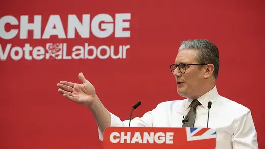 Labour Party leader Keir Starmer speaks in front of a sign reading "CHANGE: VOTE LABOUR"