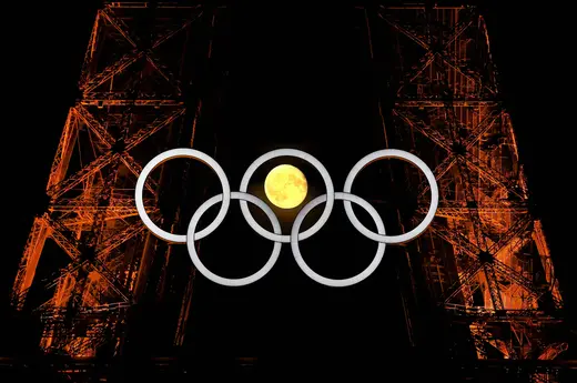 The moon is pictured with the Olympic rings on the Eiffel Tower ahead of the Paris 2024 Olympic and Paralympic Games in Paris, France, July 23, 2024. REUTERS/Kai Pfaffenbach