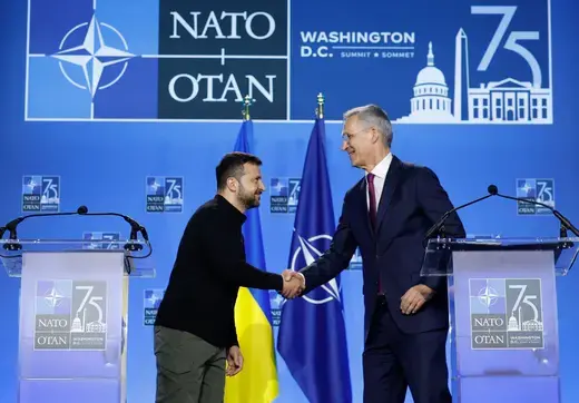 Ukrainian President Volodymyr Zelenskyy and NATO Secretary Jens Stoltenberg greet each other during a press conference at the 2024 NATO Summit in Washington, DC, on July 11, 2024. 