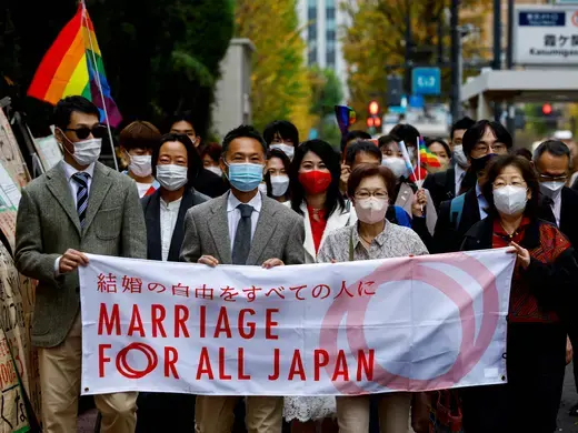 Plaintiffs, lawyers and supporters march as they head to the court which will rule on the constitutionality of same-sex marriage, in Tokyo, Japan, November 30, 2022. 