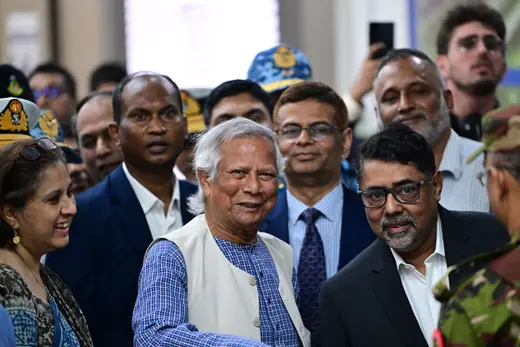 Nobel laureate Muhammad Yunus is received by the officials upon his arrival at the Hazrat Shahjalal International Airport in Dhaka, Bangladesh, on August 8, 2024. Munir Uz Zaman/AFP/Getty Images