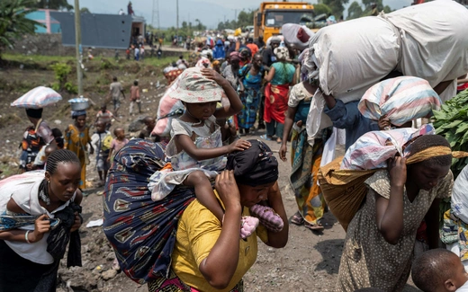 Congolese people carry their belongings as they flee following clashes between M23 rebels and the Armed Forces of the Democratic Republic of Congo (FARDC); towards Goma, Democratic Republic of Congo, on February 7, 2024.