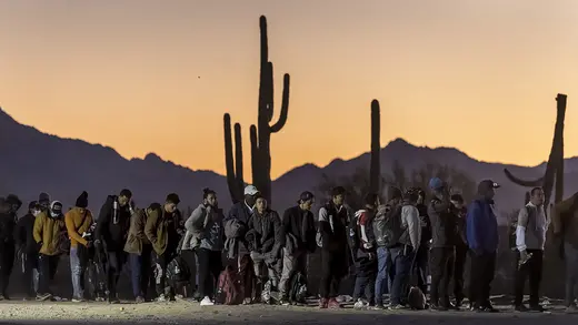 Immigrants wait at a U.S. Border Patrol processing center in Lukeville, Arizona.