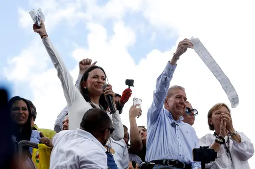 Opposition leader Maria Corina Machado and opposition candidate Edmundo Gonzalez gesture as they address supporters after election results awarded Venezuela's President Nicolas Maduro with a third term, in Caracas, Venezuela July 30, 2024.