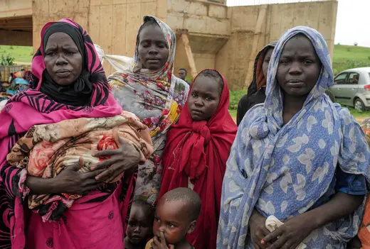 Sudanese women, who fled the conflict in Murnei in Sudan's Darfur region, look on while crossing the border between Sudan and Chad in Adre, Chad August 4, 2023. 