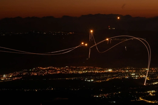 Rockets fired from southern Lebanon are intercepted by Israel's Iron Dome air defense system over northern Israel on August 23, 2024. Jalaa Marey/AFP/Getty Images