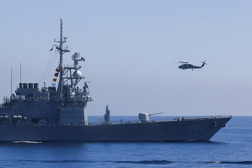 A helicopter takes off from a guided-missile destroyer as part of Taiwan’s annual military exercises.