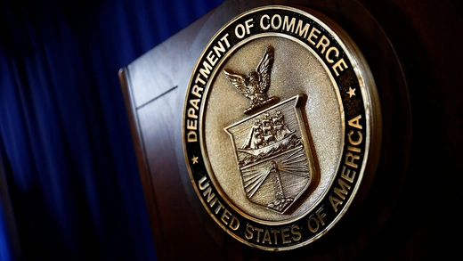 The seal of the U.S. Department of Commerce on a podium.