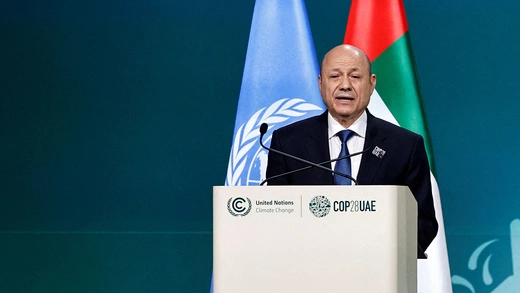 Yemen's President Rashad Mohammed Ali Al-Alimi speaks at a podium at the United Nations Climate Change Conference (COP28) in Dubai, United Arab Emirates.