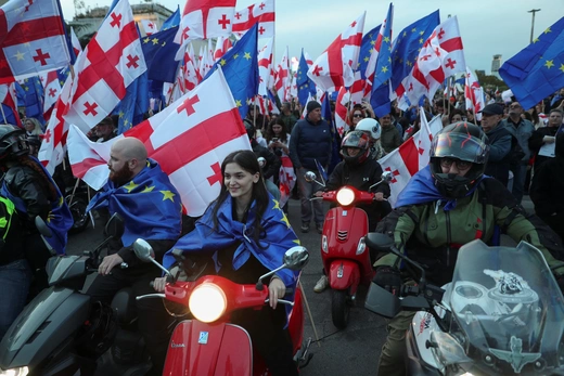 Supporters of Georgia's pro-Western and pro-EU opposition groups hold a joint final campaign rally ahead of parliamentary elections in Tbilisi, Georgia, on October 20, 2024. Irakli Gedenidze/Reuters