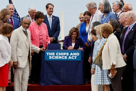 Then U.S. House Speaker Nancy Pelosi signs the CHIPS and Science Act on Capitol Hill, in July 2022.