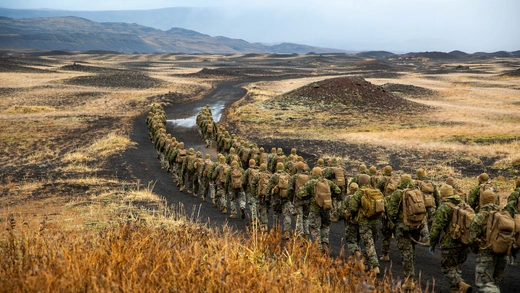 U.S. Marines with the 24th Marine Expeditionary Unit, deployed during Exercise Trident Juncture 18, hike to a cold-weather training site inland in Iceland, October 19, 2018