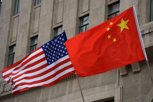 The U.S. and Chinese flags flying outside of the Fairmont Peace Hotel in Shanghai, China, on April 25, 2024. Wang Gang/VCG/Getty Images