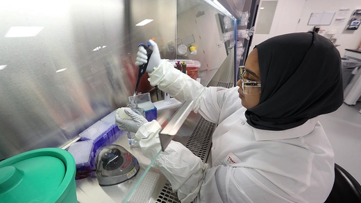 Plainville, MA - September 19: Thermo-Fisher Scientist Nour Tabidi prepares a DNA sample in a lab.