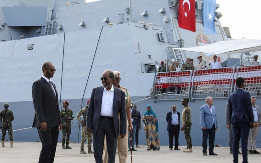 Somali President Hassan Sheikh Mohamud walks near a Turkish Navy Ship after it docked at the Mogadishu Sea Port following the signing of a defense and economic agreement between Somalia and Turkey in Mogadishu, Somalia on April 23, 2024.