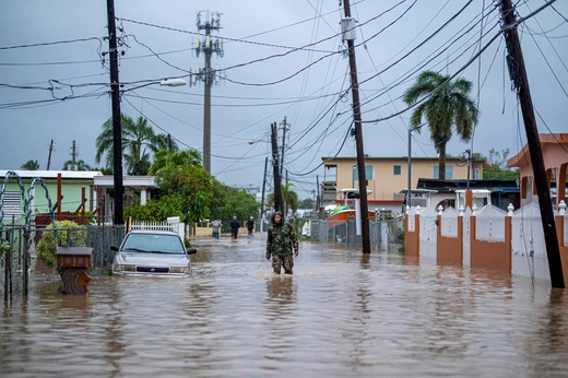 A member of the Puerto Rican National Guard searches for people in the wake of Hurricane Fiona.