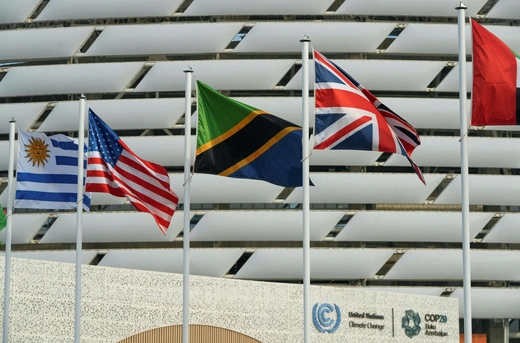 The state flags of Uruguay, the United States, Tanzania, and the United Kingdom fly near the venue of the UN climate change conference COP29 in Baku, Azerbaijan, on November 16, 2024. Janis Laizans/REUTERS