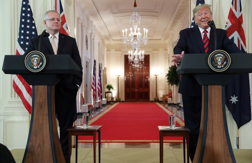 Australian Prime Minister Scott Morrison stands at a podium beside President Trump in the White House.