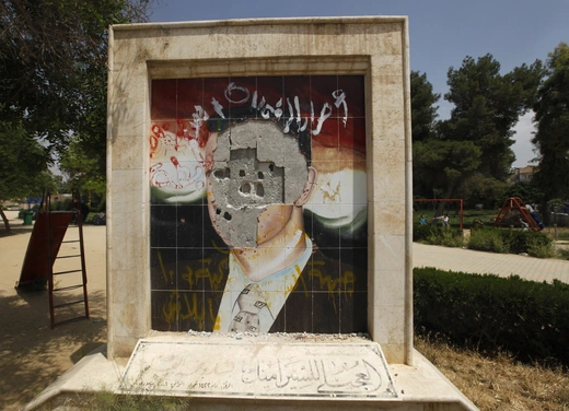 A vandalised mosaic picture of Syria's President Bashar al-Assad in a park in Raqqa province, east Syria.