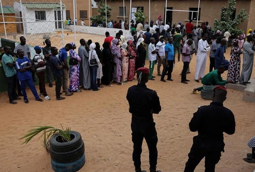 Voters line up to vote at a polling station in Parcelle, a suburb of Dakar, Senegal, on November 17, 2024. 