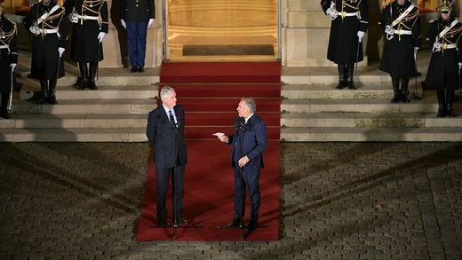 France’s outgoing Prime Minister Michel Barnier meets with newly-appointed Prime Minister Francois Bayrou during the handover ceremony in Paris on December 13, 2024.