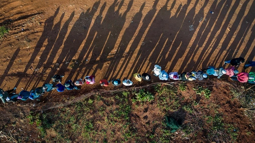 A drone view shows people queue at the Hospital Hill township to vote during the South African elections, in Johannesburg, South Africa.