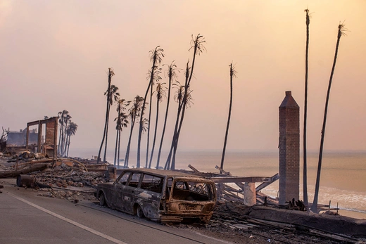 Burned vehicles are seen in Malibu as the Palisades fire burns during a windstorm on the west side of Los Angeles, California, U.S. January 8, 2025.