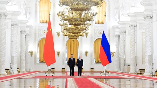 Russian President Vladimir Putin and Chinese President Xi Jinping attend a welcome ceremony before Russia - China talks at the Kremlin.