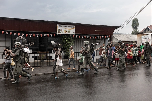 Members of the M23 armed group walk through a street of the Keshero neighborhood in Goma, Democratic Republic of Congo on January 27, 2025.