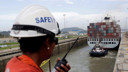 The cargo ship Cosco Houston tests a new set of locks at the Panama Canal as part of a canal expansion project, in June 2016.